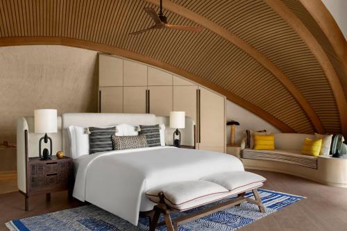 A bed or beds in a room at Nujuma, a Ritz-Carlton Reserve