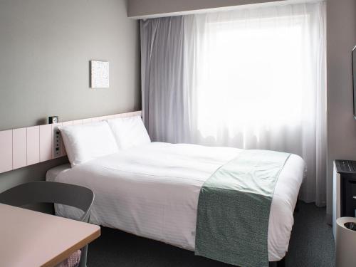Postel nebo postele na pokoji v ubytování Vessel Inn Takadanobaba Station