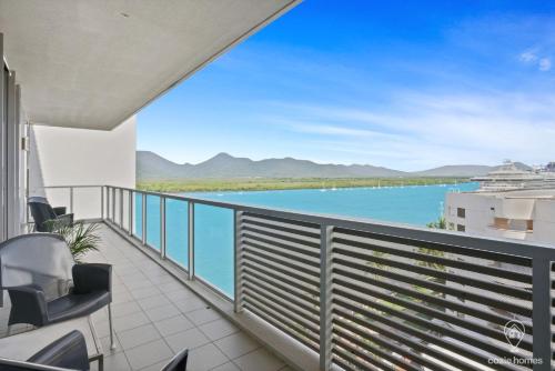 a balcony with a view of the water at 1101 Harbour Lights with Ocean Views in Cairns