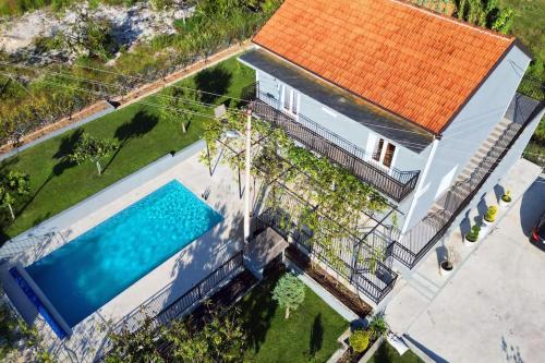 an overhead view of a house with a swimming pool at Villa Carpenter in Trebinje
