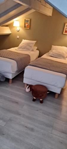Postel nebo postele na pokoji v ubytování Hôtel Du Viaduc