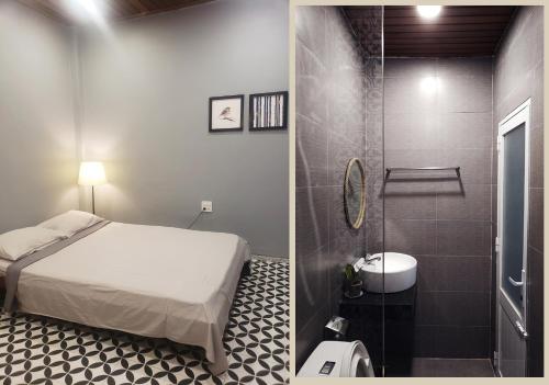 een slaapkamer met een bed en een badkamer met een douche bij Quynh's Homestay in Tuy Hoa