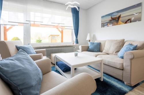 Un lugar para sentarse en Ferienhaus Objekt 215 in Tossens
