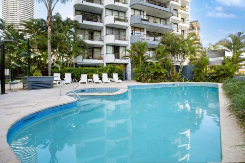 a large swimming pool in front of a building at Pacific Resort Broadbeach in Gold Coast