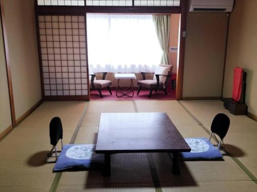 Posezení v ubytování Migumiya Ryokan