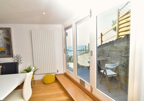 a living room with a view of the ocean at 3 Little Beach in Woolacombe