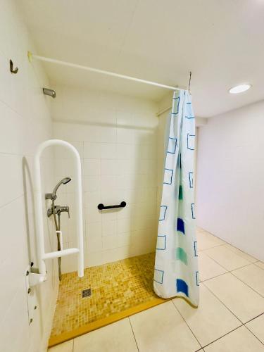 a bathroom with a shower with a shower curtain at Trill Noray A bajos Estartit in L'Estartit