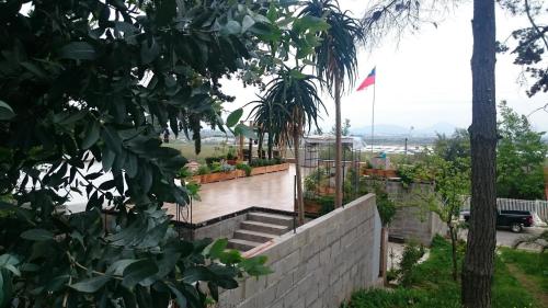 a brick wall with stairs and a flag on it at Lomas Loft in Santiago