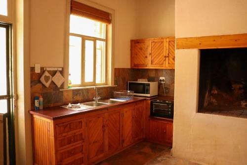 Una cocina o zona de cocina en Kleingeluk Guest Farm