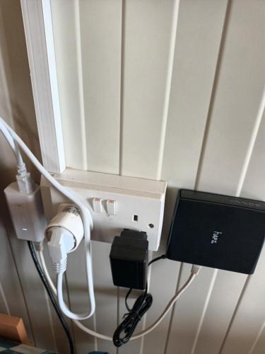 a computer monitor in a room with a window at Mazotos beach house in Mazotos