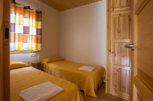 Säng eller sängar i ett rum på Camping Sitges
