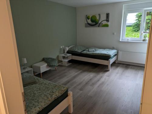 Postel nebo postele na pokoji v ubytování Hachelbach