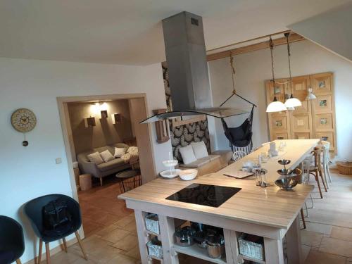 a kitchen and living room with a stove top oven at Chalupa u Pramenů in Počátky