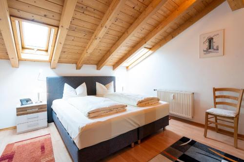 Ένα ή περισσότερα κρεβάτια σε δωμάτιο στο Haus Sonnenwinkel - SommerBergBahn unlimited kostenlos