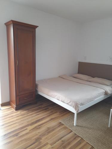 Postel nebo postele na pokoji v ubytování Apartament KLEMENS nr domu 14