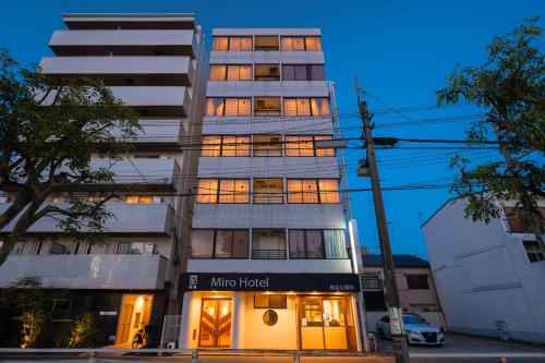 a building with a mrite hotel in front of it at Miro Hotel Momodanikoen-mae in Osaka