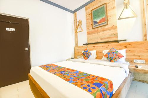 a bedroom with a bed in a room at FabExpress Neo Calangute Beach Resort in Calangute