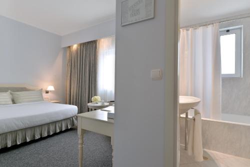 Cama o camas de una habitación en Airotel Stratos Vassilikos Hotel