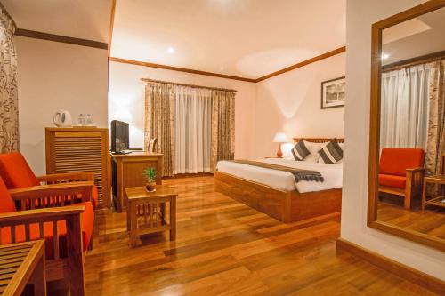 Ένα ή περισσότερα κρεβάτια σε δωμάτιο στο Cheathata CTA Hotel Siem Reap