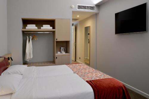 Cama o camas de una habitación en Airotel Stratos Vassilikos Hotel