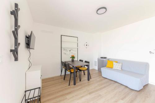 a living room with a table and a couch at Apartma Lajf in Brežice