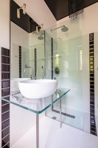 a bathroom with a glass counter with a sink at Tenuta Moncarlino in Morsasco