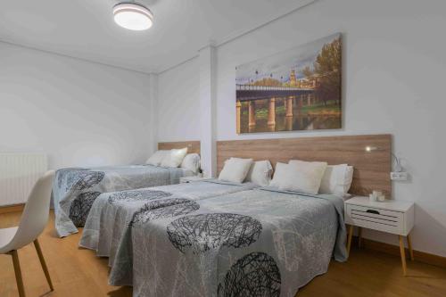 Postel nebo postele na pokoji v ubytování CINCO VILLAS