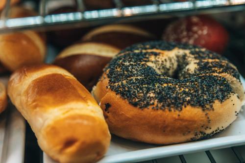 a bunch of donuts are sitting on a shelf at Regency Boutique Hotel Holiday Suites in Paphos