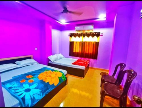 Postel nebo postele na pokoji v ubytování Kesar Guest House Usri Gate Ajmer