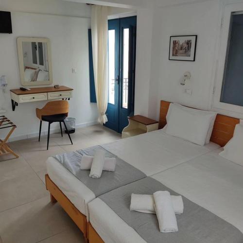 Ένα ή περισσότερα κρεβάτια σε δωμάτιο στο Anastasia Hotel