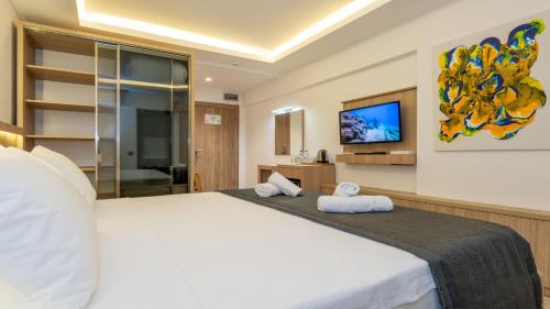 Postel nebo postele na pokoji v ubytování Skykhan Otel