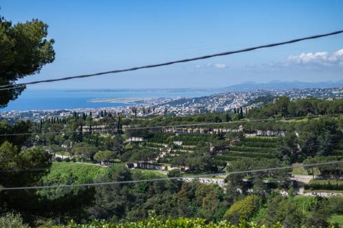 a view of the city from a hill at Villa vue mer, terrasse et spa in Nice