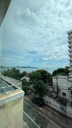a view of a city from a balcony of a building at Best Bella Pattaya in Pattaya North