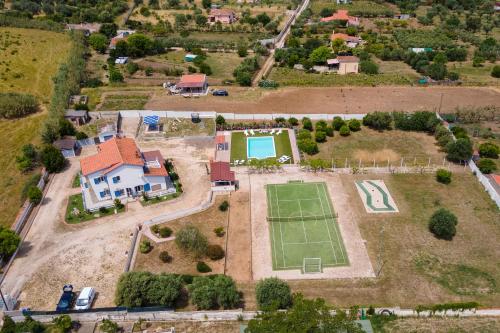 an aerial view of an estate with a tennis court at Villa Sara in Sorso