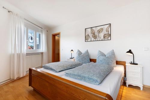 a bedroom with a bed with two pillows on it at Ferienwohnung Zola in Ettenheim