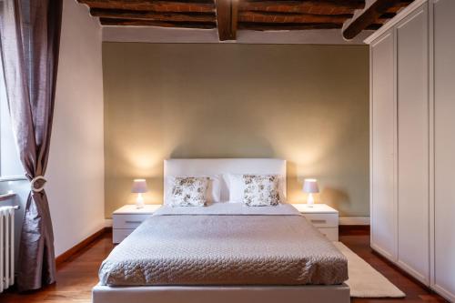Un ou plusieurs lits dans un hébergement de l'établissement Relax in Villa a due passi da Lucca