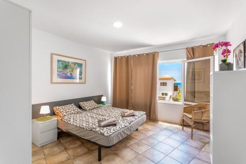 Ένα ή περισσότερα κρεβάτια σε δωμάτιο στο Apartamento Las Flores3