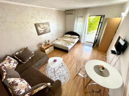 a living room with a couch and a table at Apartments Marina in Budva