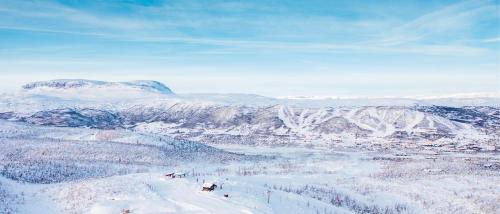a view of a ski resort in the snow at Cozy family friendly cabin at beautiful location! in Geilo