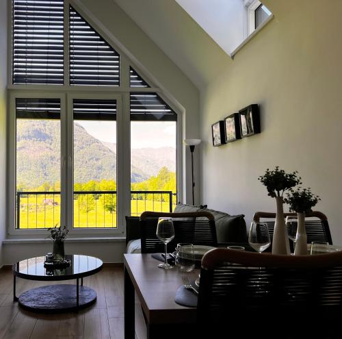 a living room with a view of a mountain at Alpine Haven in Bovec