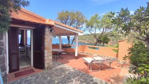 a patio of a house with a table and chairs at Appartamenti Pagni in Casa Morcone