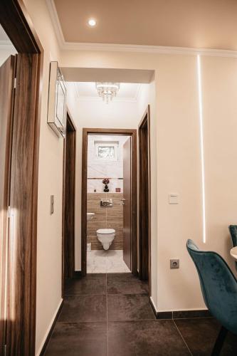 a hallway leading to a bathroom with a toilet at Luxury Wellness Home II. Balatonboglár in Balatonboglár