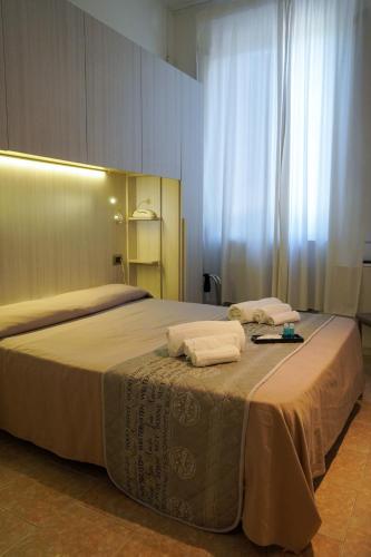 Postel nebo postele na pokoji v ubytování Hotel Cilene