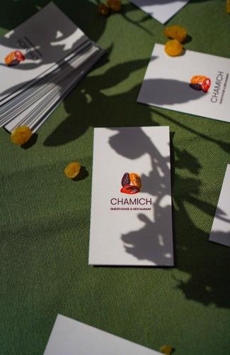 a table topped with cards on a green table at Chamich Guesthouse in Debed