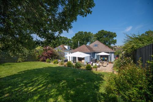 a house with a yard with green grass at The Brackens in Seaview