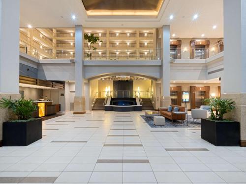 an empty lobby of a hotel with a large lobby at Embassy Suites Chicago - Downtown River North in Chicago
