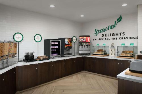 a bakery with a counter with food on it at Embassy Suites La Quinta Hotel & Spa in La Quinta