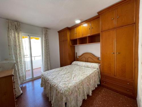 Postel nebo postele na pokoji v ubytování TERRASOL PIRAMIDES 1 DORMITORIO CALETA DE VELEZ