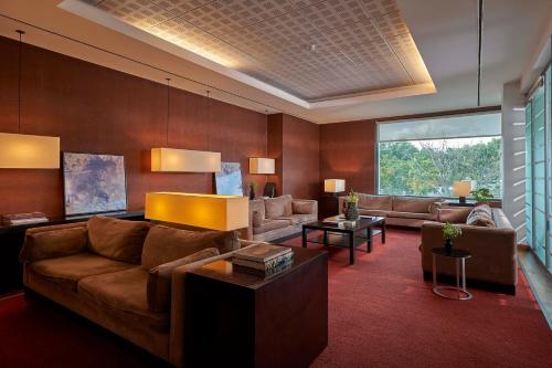 a living room with a couch and a table at Hotel Acores Lisboa in Lisbon