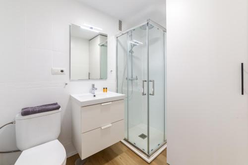 a bathroom with a shower and a toilet and a sink at Trendy Homes Aguadulce Bay in Aguadulce